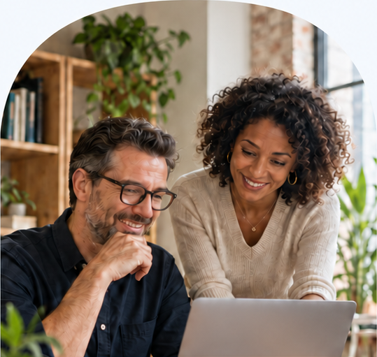 Illustrative scene of two people reviewing work together on a laptop